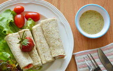 bread roll and salad dipping sauce on table
