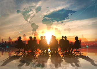 World Management Team in office silhouette 
