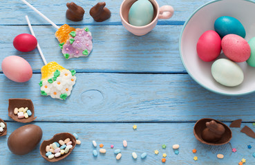 Easter Eggs Over Blue Wooden Background