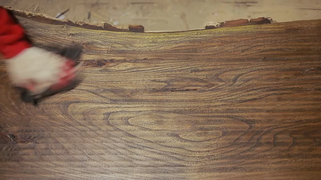 Carpenter covers the mordant plaque, dry wood