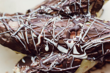 a piece of homemade biscuit cakewith chocolate sprinkles closeup