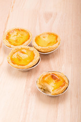 dessert egg tart sweet custard pie on wooden table background.