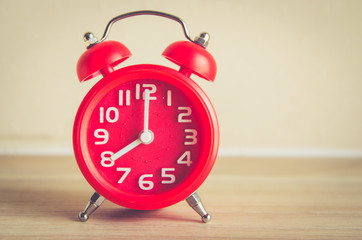 modern clock on wood table   , vintage process