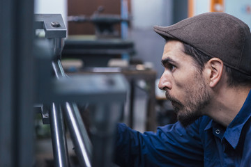 Close-up of serious craftsman measuring details