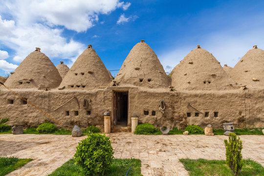 Harran, Sanliurfa. Photo of the typical Harran house. Houses is made of mudbrick. Door and small windows can be seen too. Conic shaped and mudbrick and conic roofs are special to Harran area.