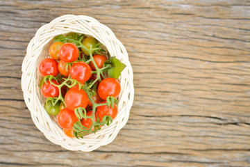 Hipster tone Top view group of tomato on old wood background, selective and soft focus