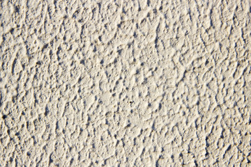 Surface of wall of building facade painted textured paint