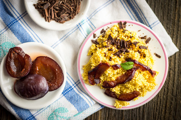 Puree of Millet Grains with Plums, Chocolate and Walnuts and Raw Ingredients. Top View Dessert - Food.