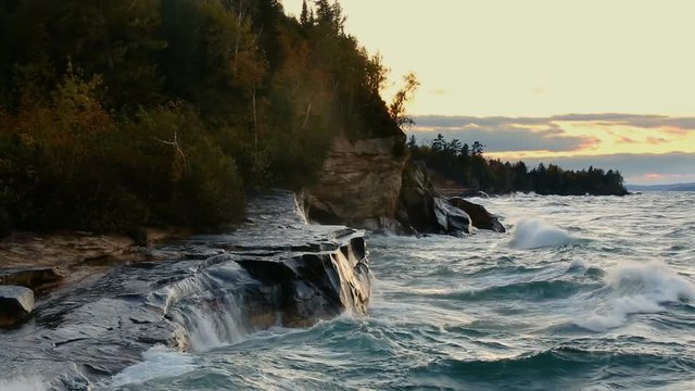Looping video features waves crashing hard on the rocky Lake Superior Coast of Upper Peninsula Michigan near Pictured Rocks National Lakeshore and the communities of Munising and Christmas.