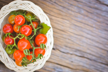 Hipster tone Top view group of tomato on old wood background, selective and soft focus