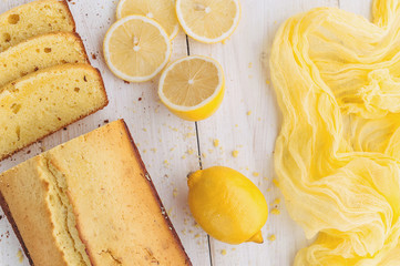lemon cake with fruits on white wooden surface