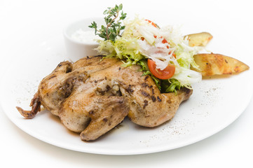 delicious grilled chicken with a side dish of vegetables and herbs