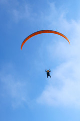 Naklejka na ściany i meble Paragliding in Ukraine over the against clear blue sky