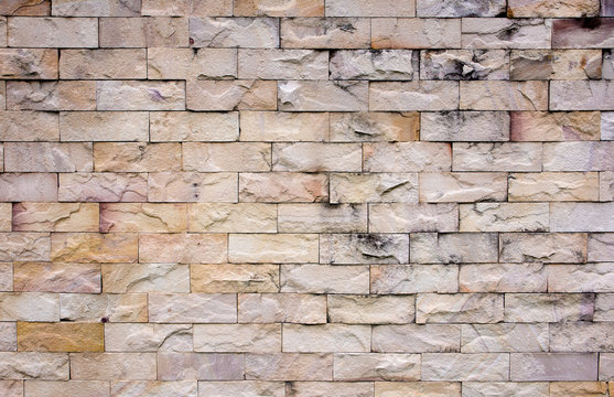 Sandstone wall texture background.Detail of sand stone wall texture.Colorful sand stone wall texture.
