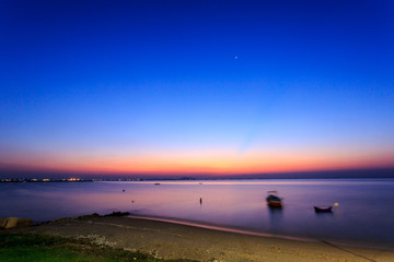 Blue sky during after sunset over the foggy sea