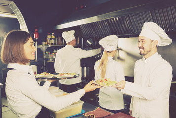 Fototapeta na wymiar Waitress in restaurant kitchen