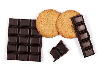 chocolate bars and round wholewheat biscuits with hazelnut isolated on white background