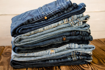 jeans pile on wooden board