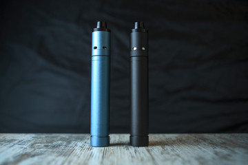 Electronic cigaretts on the table. Mechanical mod. ENDS.