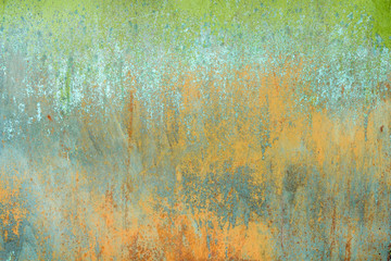 texture of old rusty shabby background with scratches, with the remains of green and blue paint
