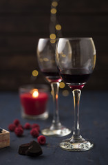 Festive glass of wine with chocolate candies