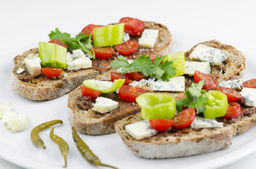 Healthy Breakfast. Home Baked Bread With Olive Pesto, Blue Cheese, Vegetables And Spices Closeup