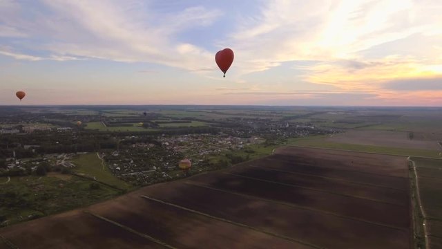 Red balloon in the shape of a heart.Aerial view:Hot air balloon in the sky over. 4K video,ultra HD.