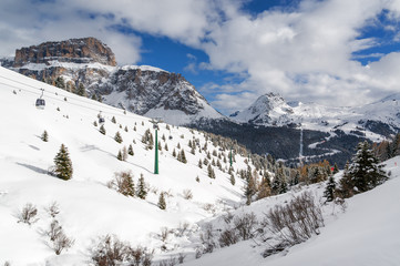 Fototapeta na wymiar Sunny view of Dolomites from Belvedere valley near Canazei of Val di Fassa, Trentino-Alto-Adige region, Italy.