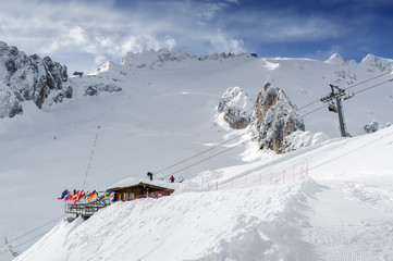 Fototapeta na wymiar Cloudy view of Dolomites near Val di Fassa, Trentino-Alto-Adige region, Italy.