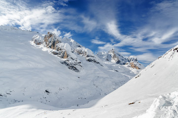 Fototapeta na wymiar Cloudy view of Dolomites near Val di Fassa, Trentino-Alto-Adige region, Italy.