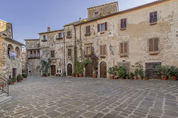 The wonderful Piazza del Castello square in the historic center of Montemerano, Grosseto, Tuscany, Italy