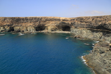 Fototapeta na wymiar Black volcanic caves on the coast near Ajuy village, Fuerteventura