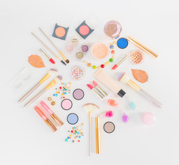 Fototapeta na wymiar Colorful make up and brushes flat lay top view scene on white background