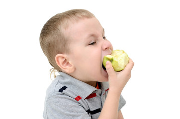 Boy eating an apple on a white background