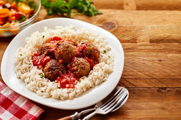 Homemade Meal of Saucy Meatballs on a Bed of Rice