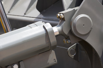 Chrome- plated hydraulic mechanism close-up shot