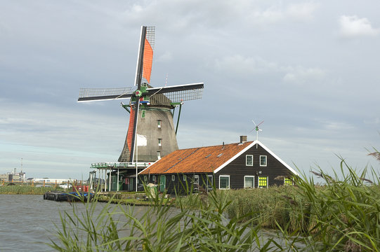 Ancient windmills in Zaanse Schans museum, near Westzaan, Netherlands.