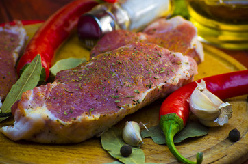 raw meat steaks with spices