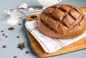 Rye bread on towel on table with spices