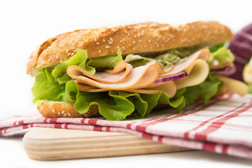 Sandwich with turkey breast, cheese and vegetables