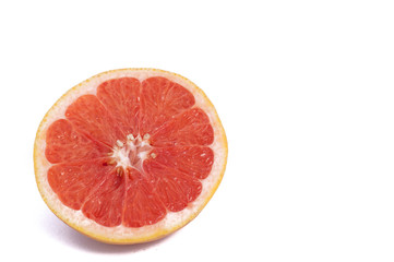 Fresh grapefruit cut in half isolated over the white background, top view