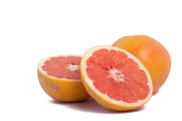 Fototapeta na wymiar red grapefruit one whole and two half isolated on white background