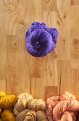 Colourful pure silk cotton on the pattern brown wood.
