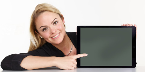 Woman presenting tablet pc with copyspace © Karin & Uwe Annas