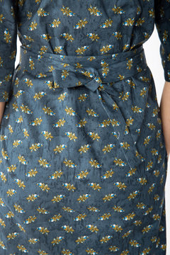 Details of women's clothing. Detail dress on a model on a white background