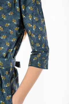 Details of women's clothing. Detail dress on a model on a white background