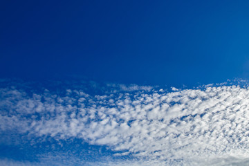Fototapeta na wymiar Texture of blue sky and clouds. Heavenly background in a highly patterned top. Free space atmospheric flight and freedom.