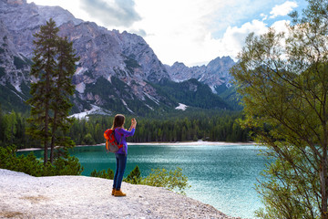 tourist girl at the Braies lake
