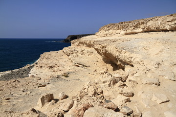 Fototapeta na wymiar Black volcanic caves on the coast near Ajuy village, Fuerteventura