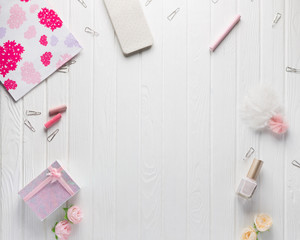 Workspace with women's accessories on a white old wood background